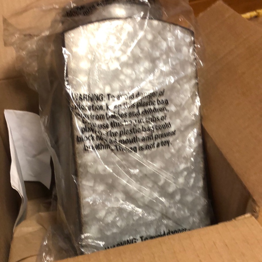 Metal canister still in box